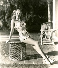 The American actress Betty Grable wears a fancy swimsuit
