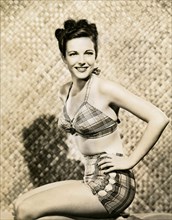The American actress Cathy Downs wearing a two-piece swimsuit 40s