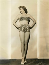 The American actress Suzi Crandall wears a two-piece swimsuit 40s