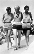 Entitled: "Swimwear on catwalk deauville France, 1928." Fashion is a distinctive and often habitual trend in the style in which a person dresses. It is the prevailing styles in behavior and the newest...