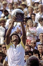 Yannick Noah celebrates after winning the 1983 French Open final at Roland Garros.