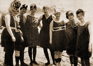 A circa 1910 photograph of a group of young ladies in Britain modelling fashionable swimwear of the time