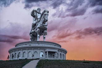 Sunset over the Genghis Khan Equestrian Statue at Tsonjin Boldog near Ulaanbaatar, Mongolia.