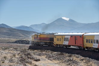 San Antonio de los Cobres, Salta, Argentina - August 31 2012: View of the locomotive and wagons of the tren a las nubes and the landscape of the high