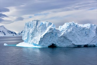 A beautiful blue iceberg floating in Antarctica.
