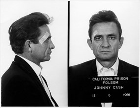 1966 , 8 november , USA :  Mugshot of rock'n roll singer and composer JOHNNY CASH ( 1932 - 2003 ), taken at Folsom Prison , California , the first time he performed there, apparently taken as a joke w...