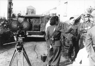 LENI RIEFENSTAHL (1902-2003) German film director and actress with army officers during the invasion of Poland in September 1939