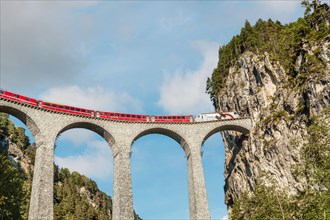 Express train at the Landwasser Viaduct in the Swiss Alps, Switzerland