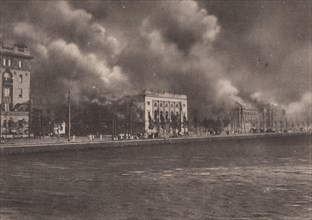 Japan Earthquake 1923: The Imperial theatre at Marunouchi enveloped by flames
