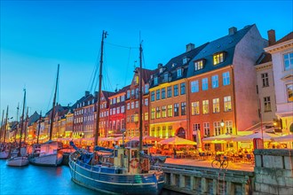 Copenhagen Denmark, night city skyline at Nyhavn harbour with colourful house