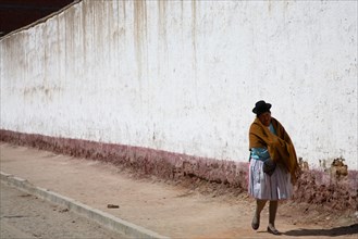 Bolivian Woman walking down baron street