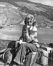 LENI RIEFENSTAHL German film producer leaves her Kitzbuhl, Austria, home  on  tailboard of a lorry in 1945.See Description below