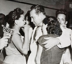 Cuban president Fulgencio Batista offering words of comfort to women whose husbands had been killed on 26th July 1953