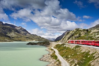 The Glacier Express train winds its way around the rocky mountain lakes of Switzerland