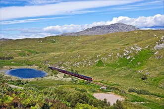 The afternoon Jacobite steam train heading towards Mallaig from Morar in the west highlands of Scotland
