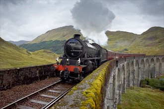 the jacobite steam train crossing the glenfinnan viaduct