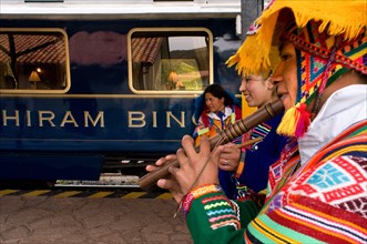 Peru Luxury train from Cuzco to Machu Picchu. Orient Express. Belmond. Musicians and dancers in traditional costumes brighten up