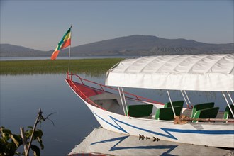 A boat with the Ethiopian flag on Lake Hawassa, Ethiopia.
