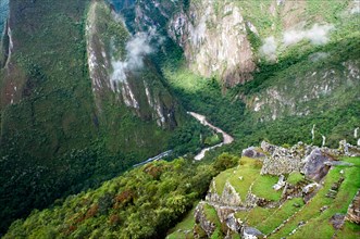 View of the winding road leading to the train des train the archaeological complex of Machu Picchu. Machu Picchu is a city located high in the Andes M