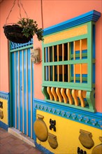 colourful colonial style building facade details in Guatape Colombia