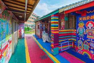 TAICHUNG, TAIWAN - JULY 19: Rainbow village is a popular travel destination where people can view colorful paintings and illustrations on the walls of