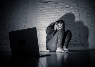 Woman suffering Internet cyber bullying