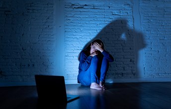 Woman suffering Internet cyber bullying