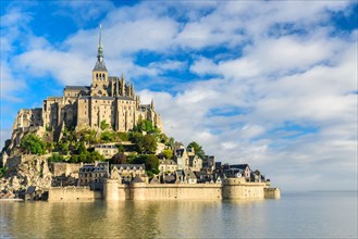 Mont Saint Michel abbey on the island, Normandy, Northern France, Europe at sunrise