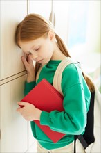 Distraught redhead schoolgirl in depression
