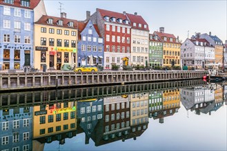 Reflections of colourful houses in the calm water of Nyhavn Canal in wonderful Copenhagen, February 16, 2019