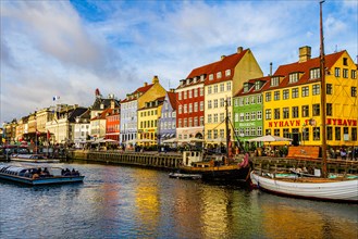 Nyhavn, a 17th century canal and harbour area with bars and restaurants and popular with tourists, in the capital city of Copenhagen, Denmark. 2019.
