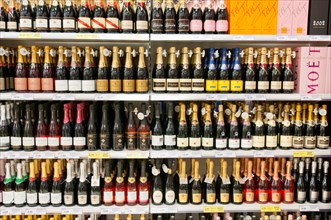 Champagne on shelves in the off-licence department of a Tesco store including Moet and Chandon, Lanson, Mumm, Chignot, Carpentier, Heidesck, Hardy's.