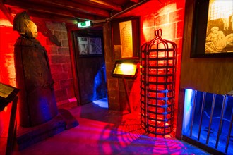 Iron Maiden and a hanging cage in the Torture Museum in Amsterdam, The Netherlands, Europe.