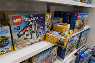 LEGO toys on display on shelves at toy store - USA