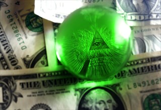 Eye of Providence all-seeing eye from US one dollar bill under glass globe, illuminati symbol