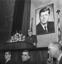 Chicago Mayor Richard J. Daley speaks at a memorial service for President Kennedy in Chicago in 1963.  Seated in front are Daly sons John,left, and future mayor, Richard M. Daley.