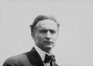 Illusionist and escape artist Harry Houdini, New York City, 7th July 1912. That same day he performed his famous stunt in which he was submerged in the East River in a crate. He escaped in just under ...
