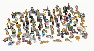 100+ ceramic figurines,that's 100+ King cake.usually in Provence KC contains 1 dried bean (feva) and 1 firgurine (sujet)