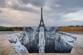 JR anamorphic artwork in front of the Eiffel Tower in Paris