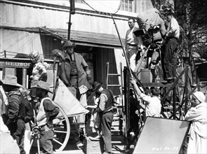 JOAN BENNETT as Salomy Jane EUGENE PALLETTE and Director RAOUL WALSH on set candid with Movie / Camera Crew during filming of WILD GIRL 1932 director RAOUL WALSH story Salome Jane's Kiss by Bret Harte...