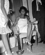Singer Nina Simone relaxes at  a press reception held at Philips record company building at Stanhope PlaceJuly 1965