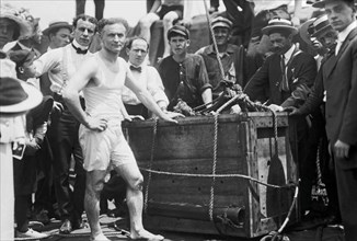 HARRY HOUDINI (1874-1926) Hungarian/American escape artist after freeing himself from a locked crate submerged  in the East River, New York, in 1912