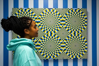 London, UK.  15 November 2022. A staff member views 'Rotating Snakes', 2022, by Akiyoshi Kitaoka, a demonstration of the Fraser-Wilcox illusion, at a preview of the new Twist (The Way I See Things) Mu...