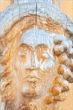 Man portrait carved on wood