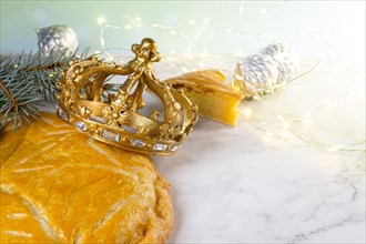 Three kings cake or galette des rois in French. Traditional epiphany cake with decorative crown.