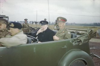 The Visit of the Prime Minister, Winston Churchill To Caen, Normandy, 22 July 1944 The Prime Minister, the Rt Hon Winston Churchill, MP, sitting in a staff car with the Commander of the British 2nd Ar...