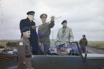 The Visit of the Prime Minister, Winston Churchill To Caen, Normandy, 22 July 1944 The Commander of the British 2nd Army, Lieutenant General Sir Miles Dempsey, pointing out a section of the front to t...