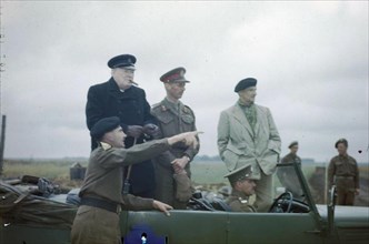 The Visit of the Prime Minister, Winston Churchill To Caen, Normandy, 22 July 1944 The Commander of the 2nd Canadian Corps, Lieutenant General G G Simonds pointing out a section of the front to Mr Chu...