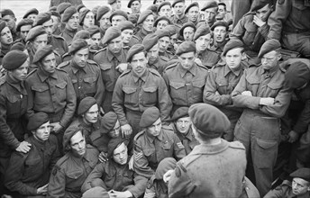 Operation Overlord (the Normandy Landings)- D-day 6 June 1944 Men of 4 Commando being briefed by Lt Col R Dawson in preparation for D Day.