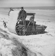 Preparations For Operation Overlord (the Normandy Landings)- D-day 6 June 1944 Churchill AVRE (Armoured Vehicle Royal Engineers) Type C Mark II carpetlayer for laying tracks across soft beaches.